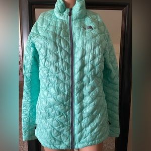 Turquoise North Face women’s jacket.